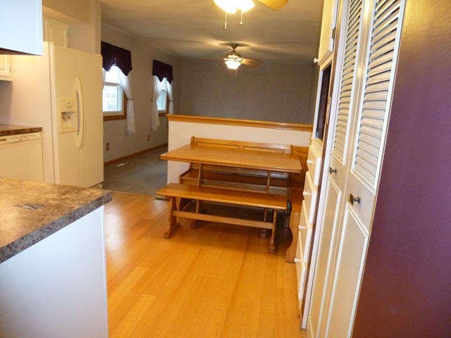 6 Crofton Road Oswego, IL 60543 - Photo 8 of 24 a view of a room with wooden floor and windows