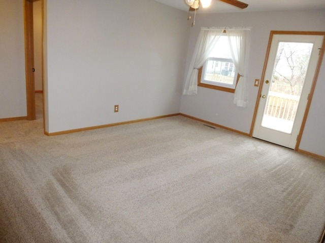 6 Crofton Road Oswego, IL 60543 - Photo 10 of 24 an empty room with a window