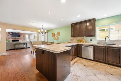 a kitchen with a sink and cabinets
