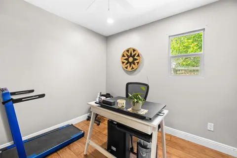a view of a workspace with furniture