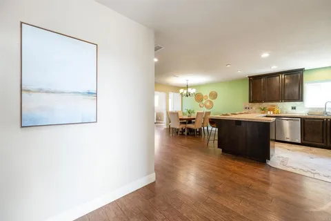 a living room with furniture and flat screen tv