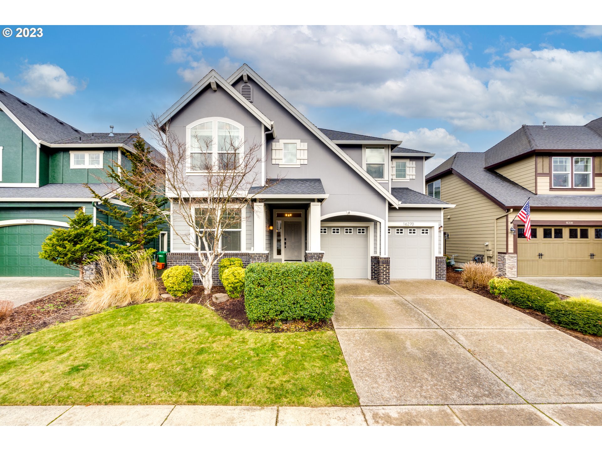 a front view of a house with a yard