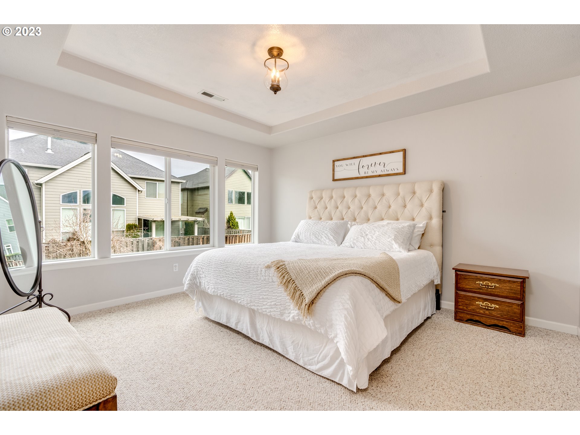16270 Southeast Jasper Drive Damascus, OR 97089 - Photo 23 of 32 a bedroom with a bed mirror and window