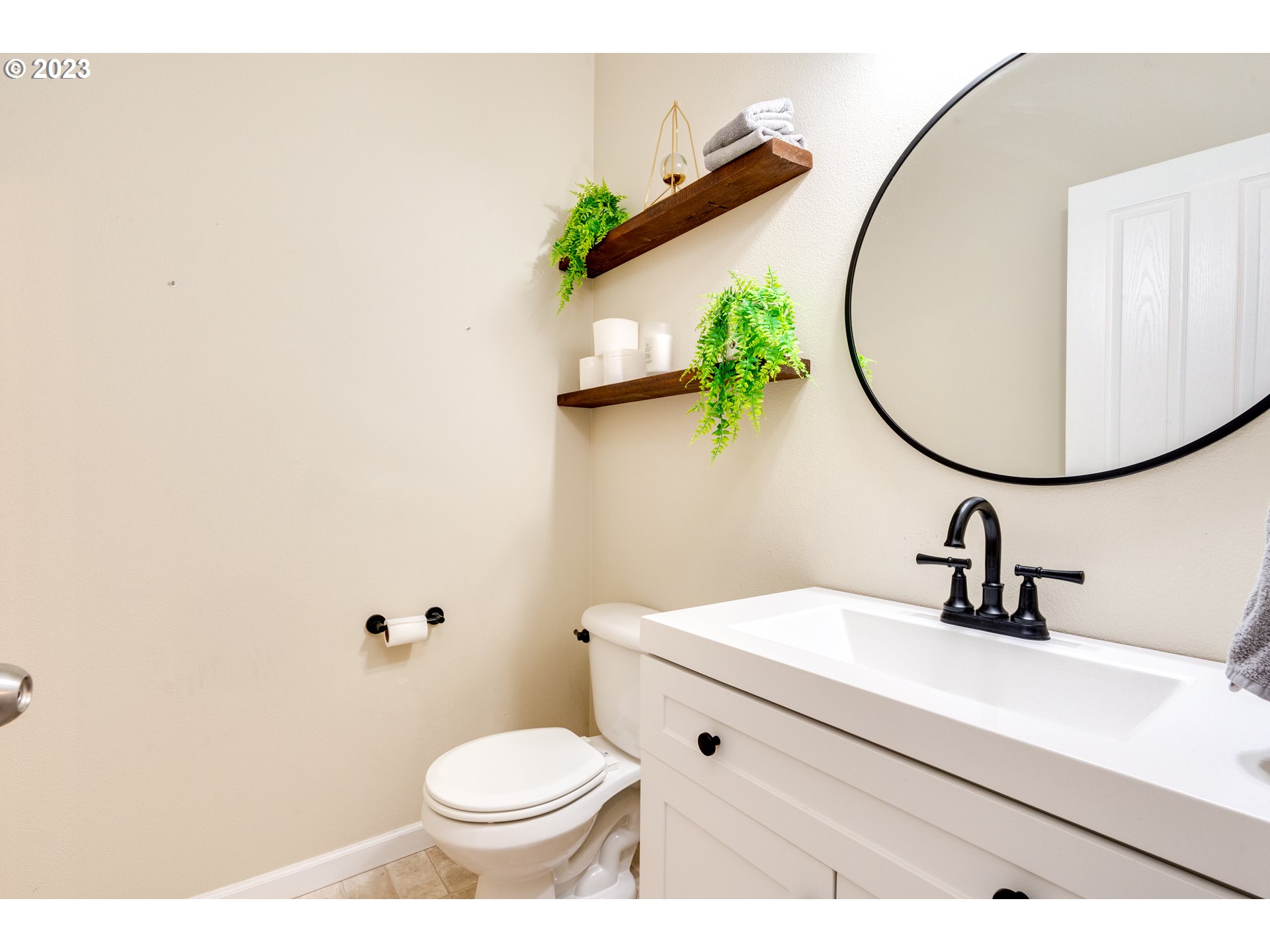 16270 Southeast Jasper Drive Damascus, OR 97089 - Photo 6 of 32 a bathroom with a sink and mirror