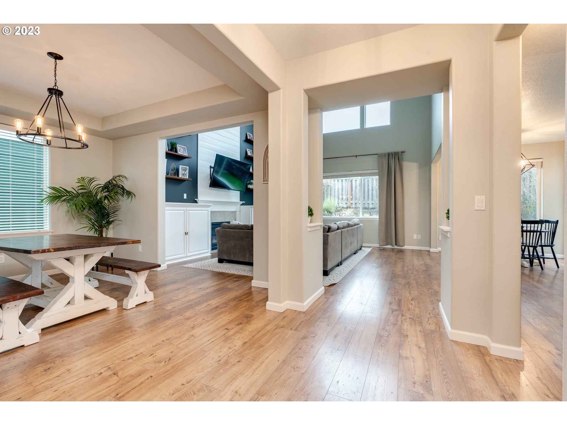 16270 Southeast Jasper Drive Damascus, OR 97089 - Photo 7 of 32 a view of a livingroom with furniture wooden floor and a chandelier