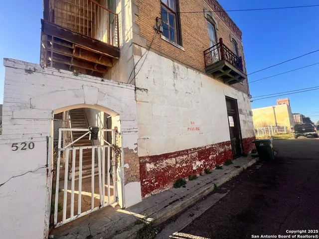 a terrace with a table and chairs