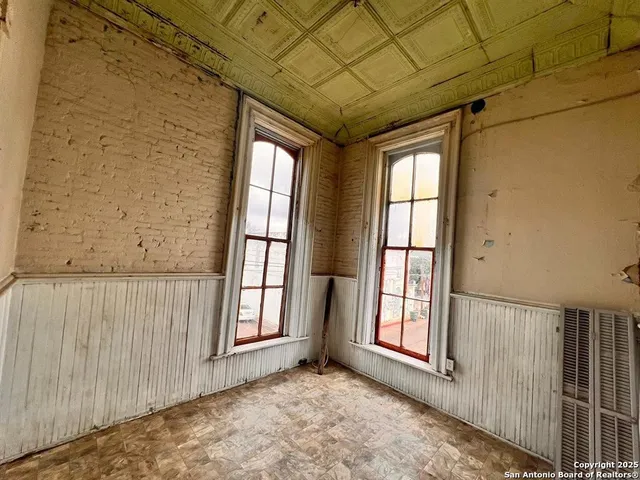 a view of a room with windows