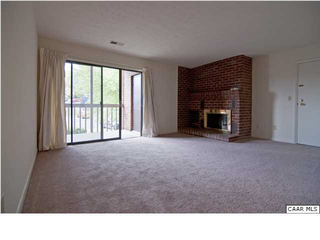 128 Turtle Creek Road, Unit 8 Charlottesville, VA 22901 - Photo 2 of 6 a open hall with a fireplace and a window