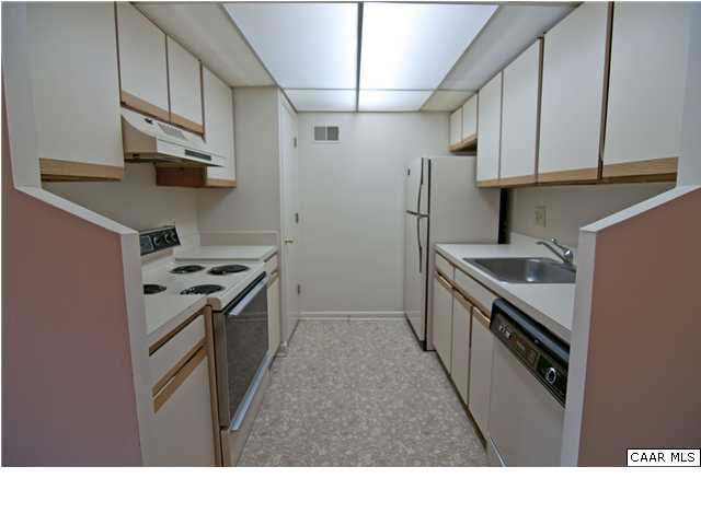 128 Turtle Creek Road, Unit 8 Charlottesville, VA 22901 - Photo 3 of 6 a kitchen with stainless steel appliances granite countertop a sink stove and refrigerator