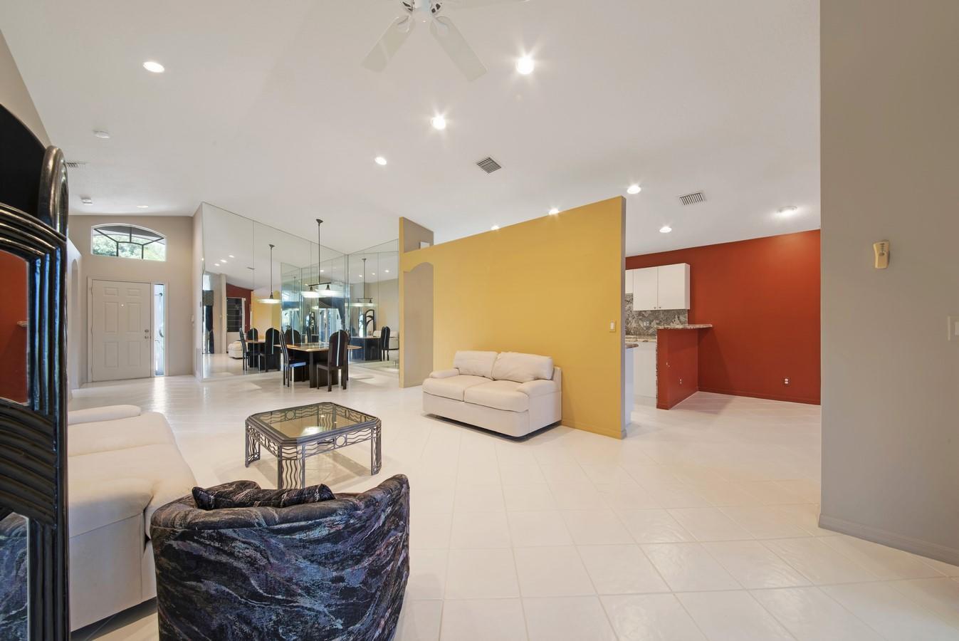 7153 Modena Drive Boynton Beach, FL 33437 - Photo 7 of 45 a living room with furniture and a flat screen tv
