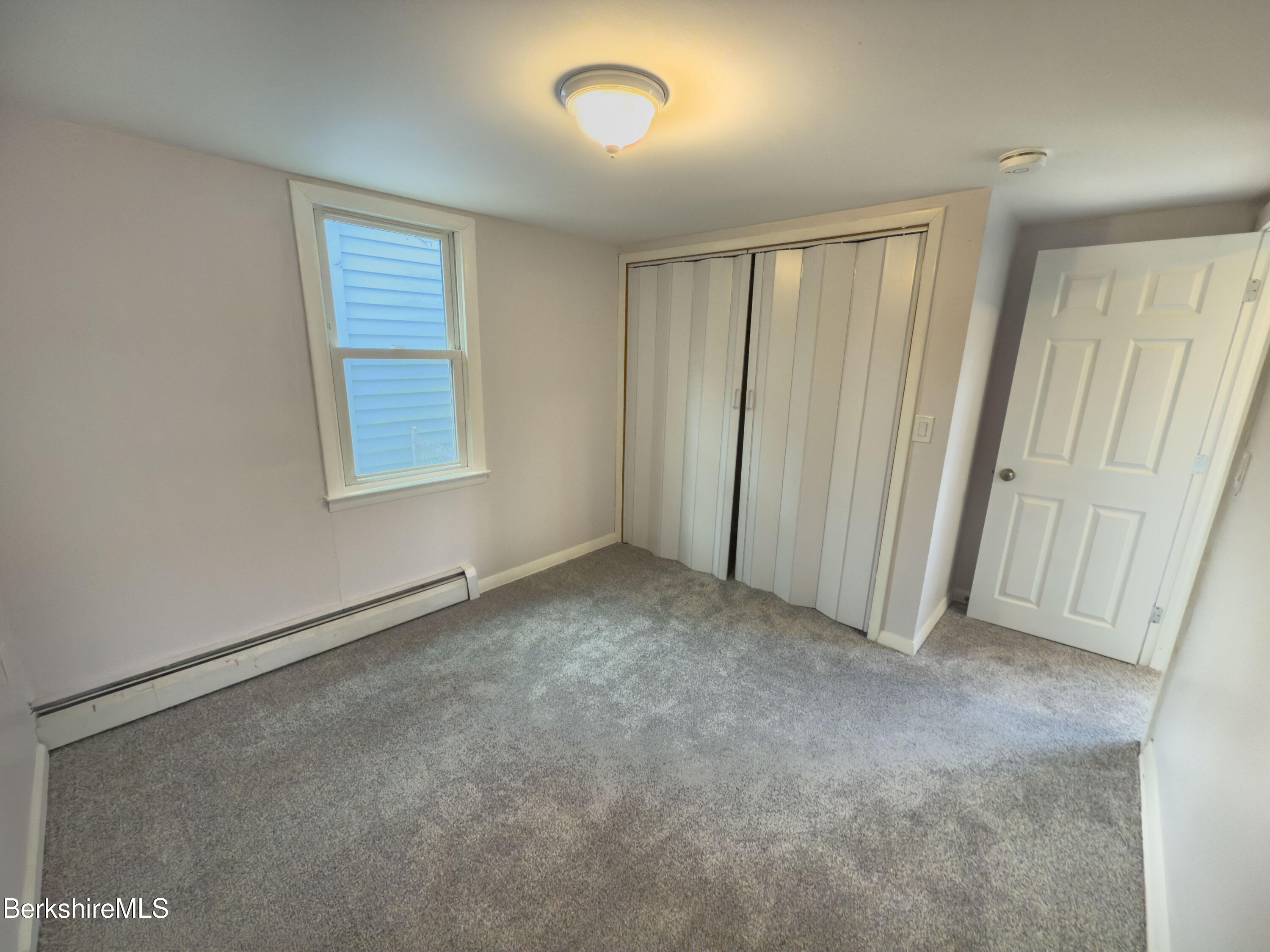 10 Enterprise Street Adams, MA 01220 - Photo 6 of 14 an empty room with windows