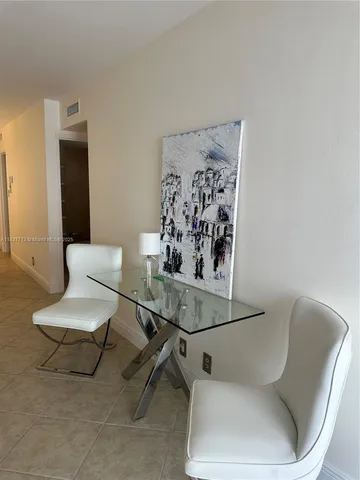 a living room with furniture and a chair