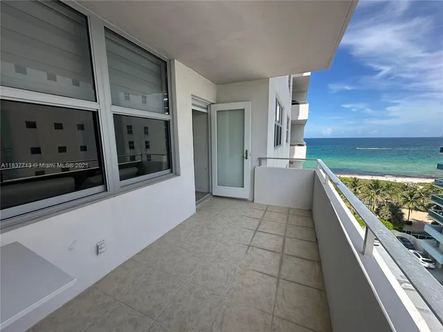 a kitchen with stainless steel appliances kitchen island granite countertop a refrigerator and a stove