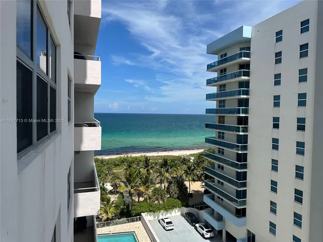 walk in closet with wooden floor