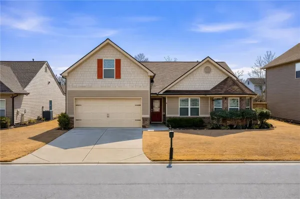 a front view of a house with yard
