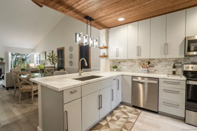 a kitchen with a sink and cabinets