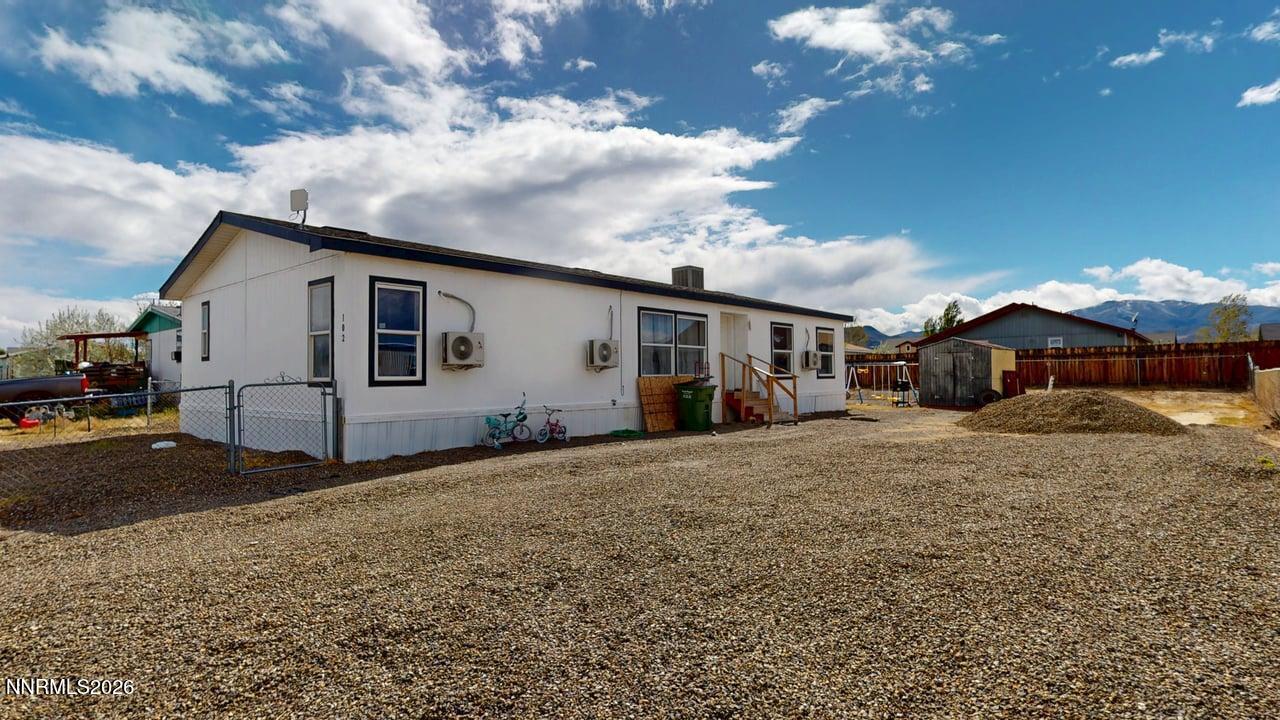 102 Bastian Road Battle Mountain, NV 89820 - Photo 1 of 38 a front view of a house with a yard