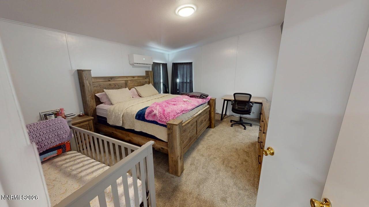 102 Bastian Road Battle Mountain, NV 89820 - Photo 21 of 38 a bedroom with furniture and a window