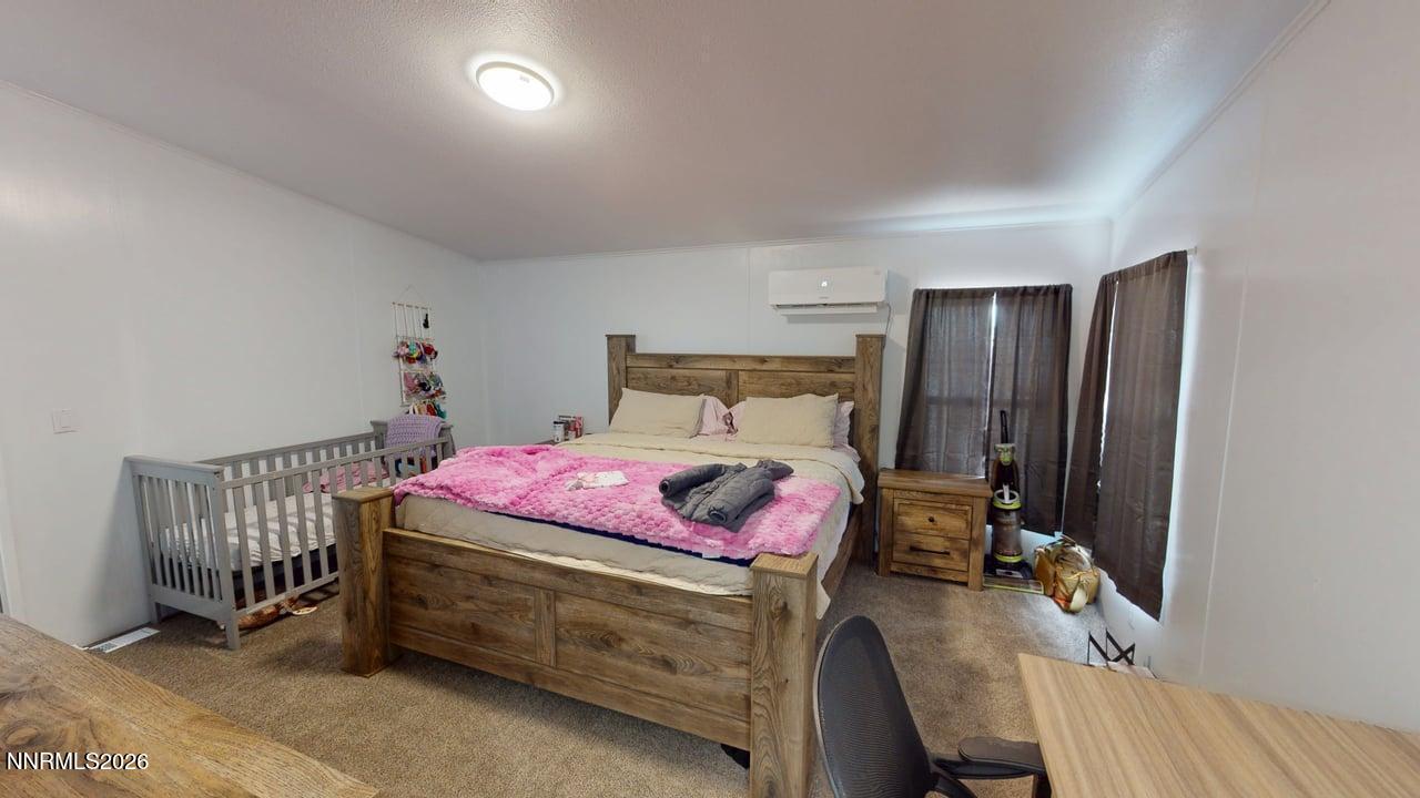 102 Bastian Road Battle Mountain, NV 89820 - Photo 24 of 38 a bedroom with a bed and a tv