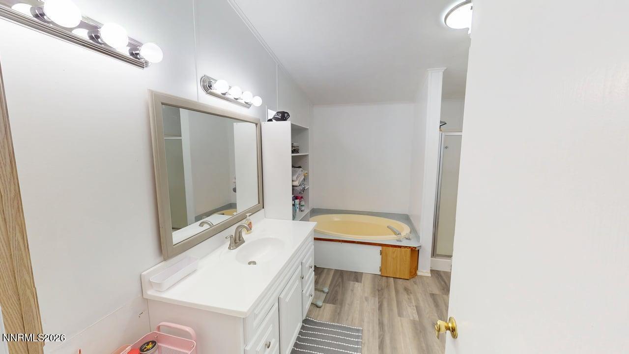 102 Bastian Road Battle Mountain, NV 89820 - Photo 25 of 38 a bathroom with a sink a toilet a mirror and shower