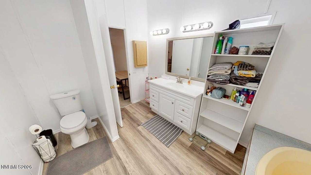 102 Bastian Road Battle Mountain, NV 89820 - Photo 27 of 38 a bathroom with a toilet sink and mirror