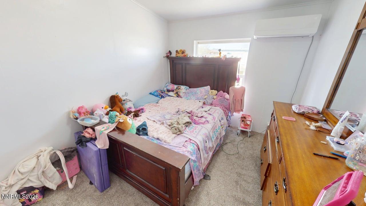 102 Bastian Road Battle Mountain, NV 89820 - Photo 28 of 38 a bedroom with a bed and a tv