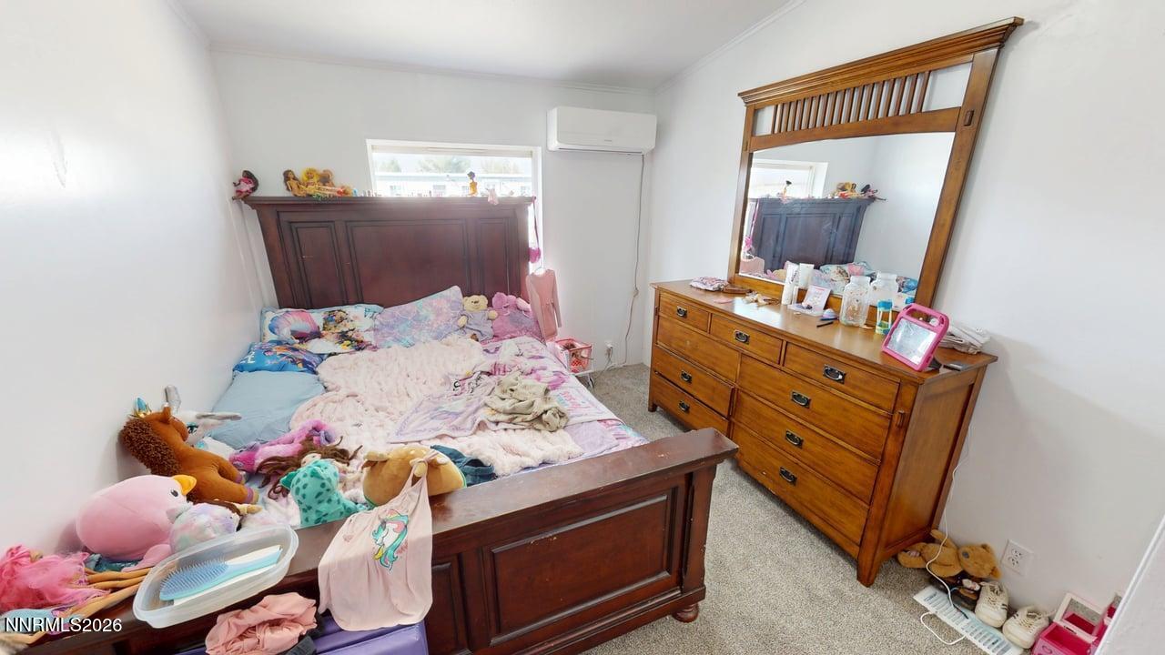 102 Bastian Road Battle Mountain, NV 89820 - Photo 30 of 38 a bedroom with a bed and wooden floor
