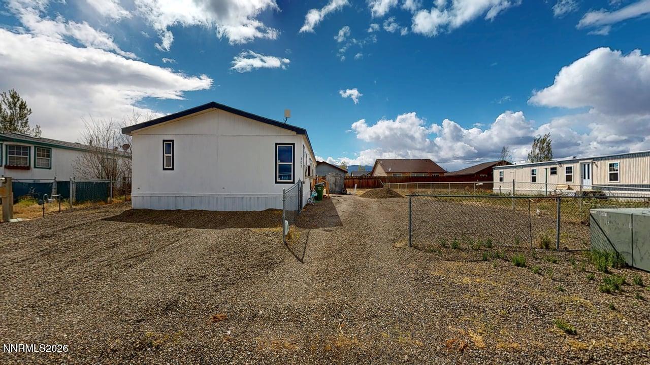 102 Bastian Road Battle Mountain, NV 89820 - Photo 3 of 38 a view of a house with a backyard