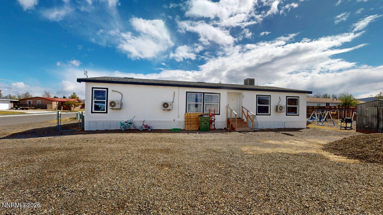 102 Bastian Road Battle Mountain, NV 89820 - Photo 5 of 38 a view of a house with backyard and sitting area