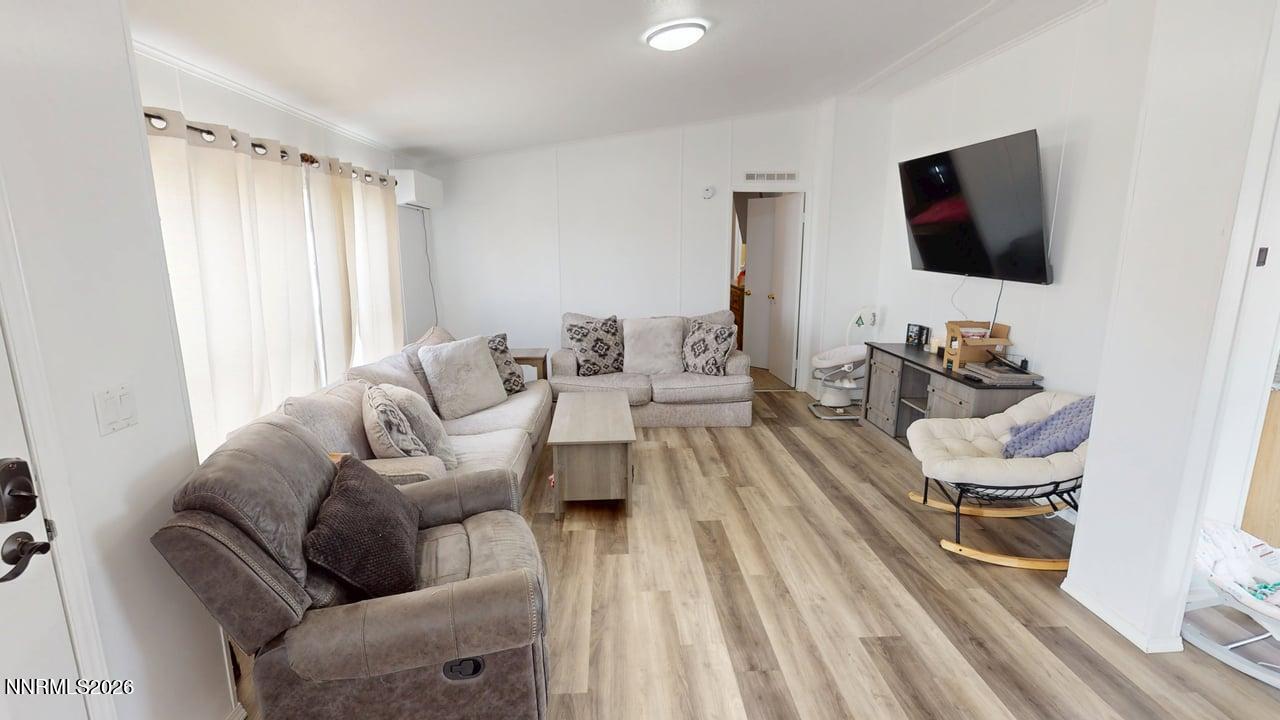 102 Bastian Road Battle Mountain, NV 89820 - Photo 10 of 38 a living room with furniture and a flat screen tv