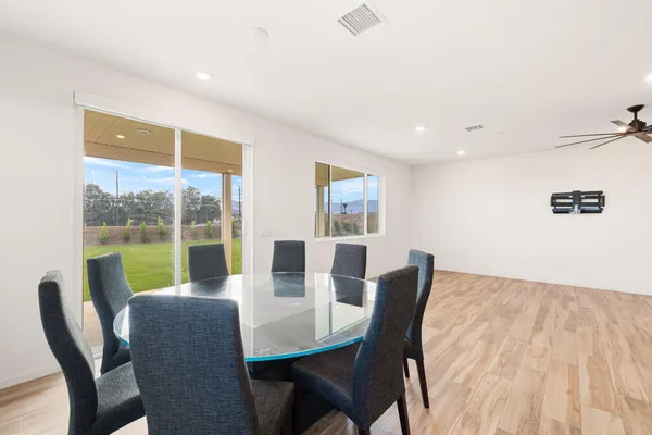 a view of a dining room with furniture window and outside view