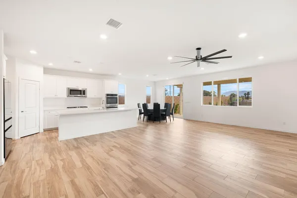 a view of kitchen with cabinets and wooden floor