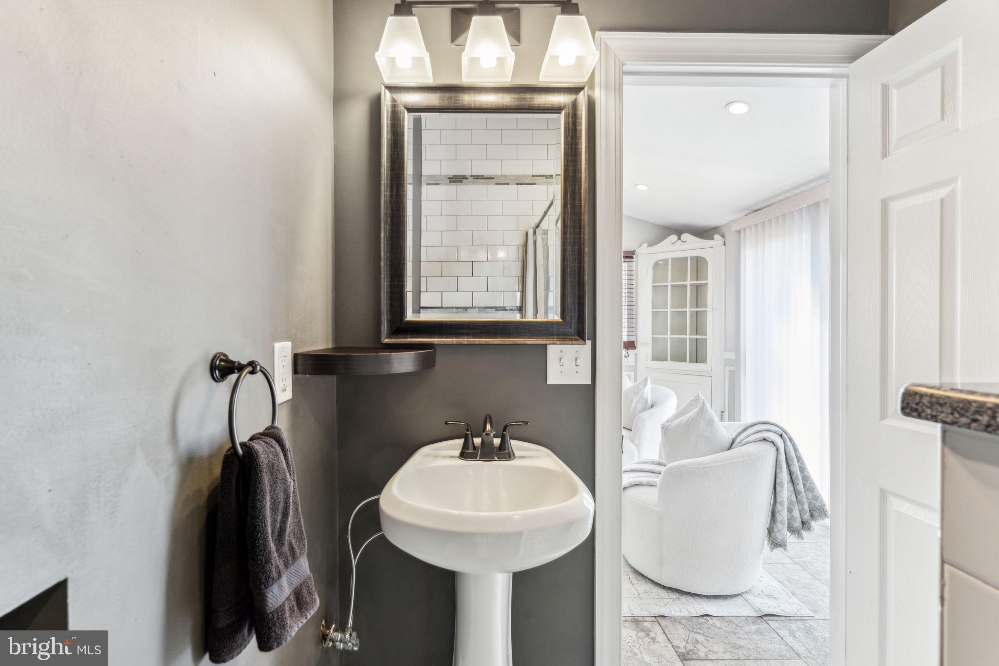 77 Concord Avenue Hamilton, NJ 08619 - Photo 18 of 45 a bathroom with a sink and a mirror