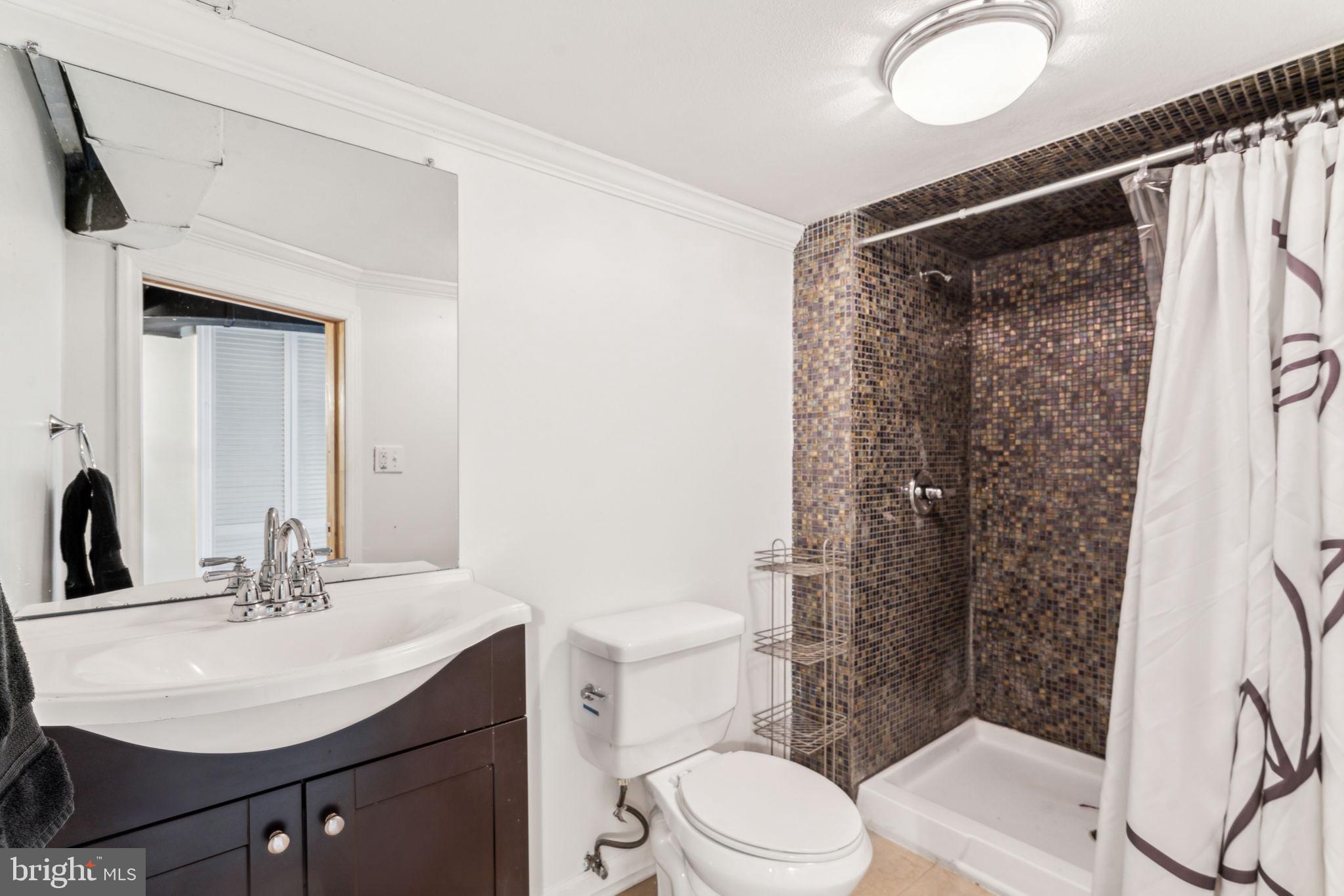 77 Concord Avenue Hamilton, NJ 08619 - Photo 21 of 45 a bathroom with a sink toilet and shower