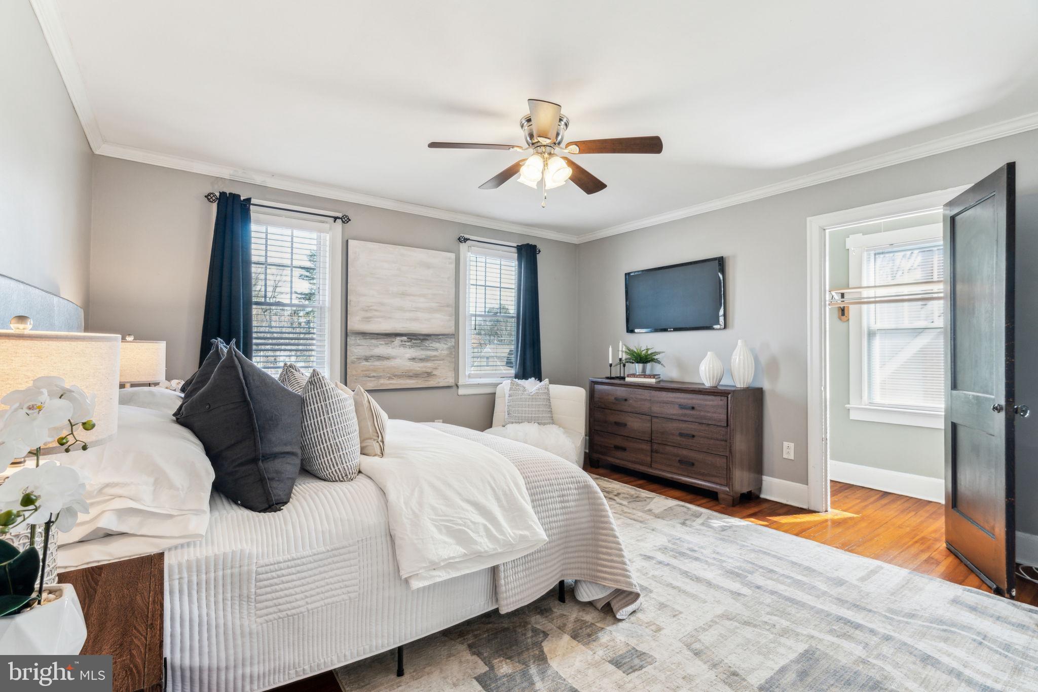 77 Concord Avenue Hamilton, NJ 08619 - Photo 25 of 45 a bedroom with a bed flat screen tv and window