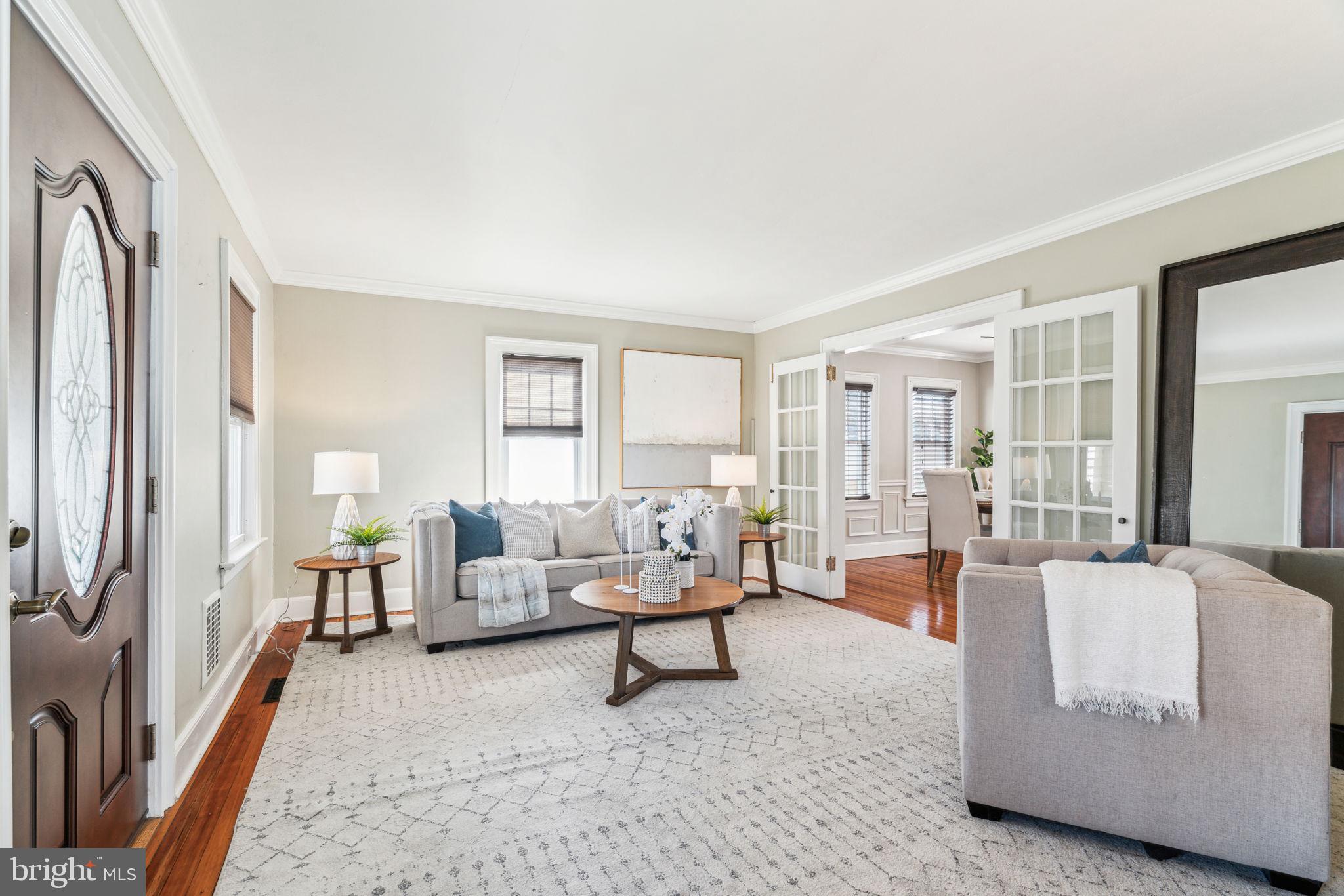 77 Concord Avenue Hamilton, NJ 08619 - Photo 3 of 45 a living room with furniture and a large window