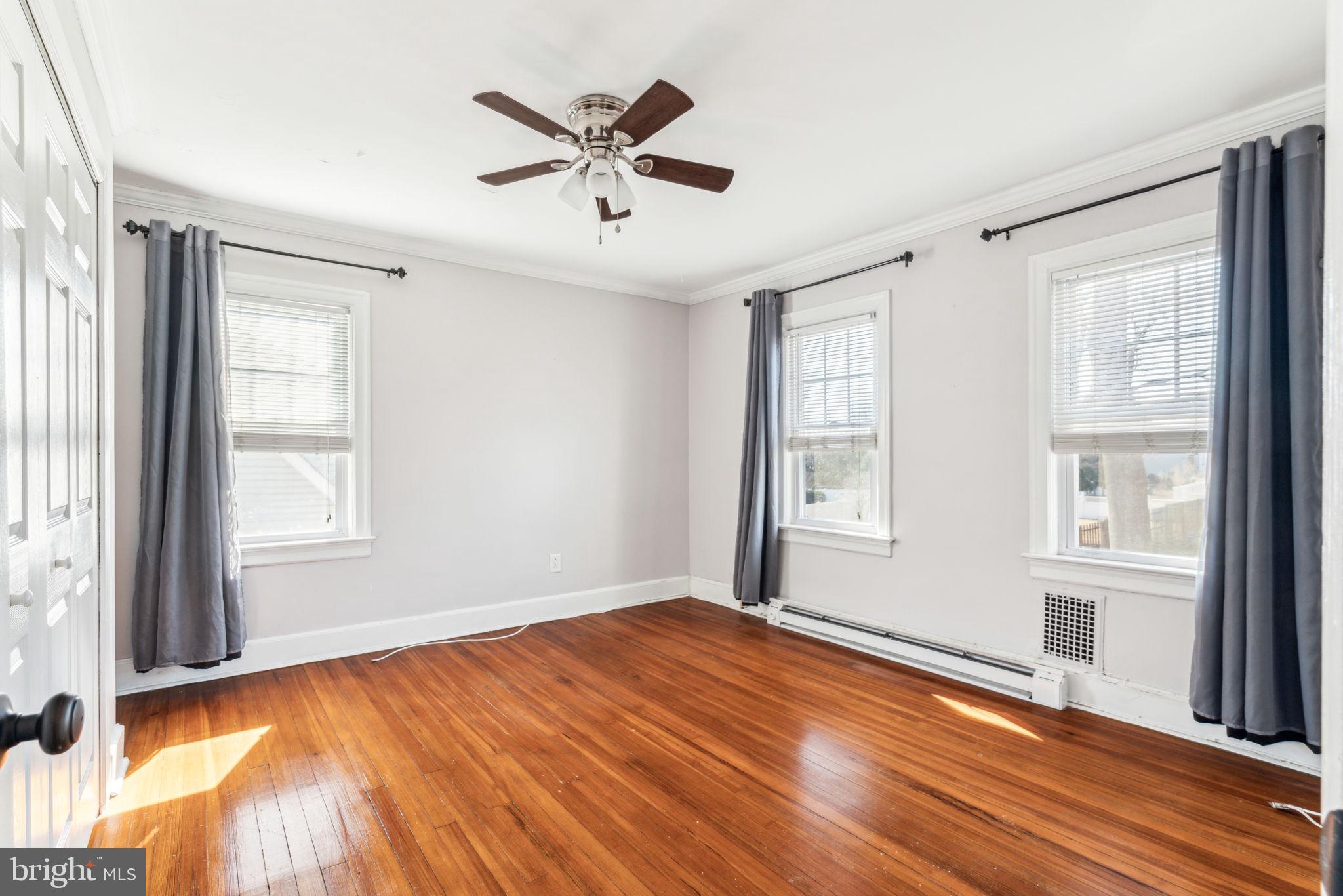 77 Concord Avenue Hamilton, NJ 08619 - Photo 34 of 45 a view of empty room with wooden floor and fan
