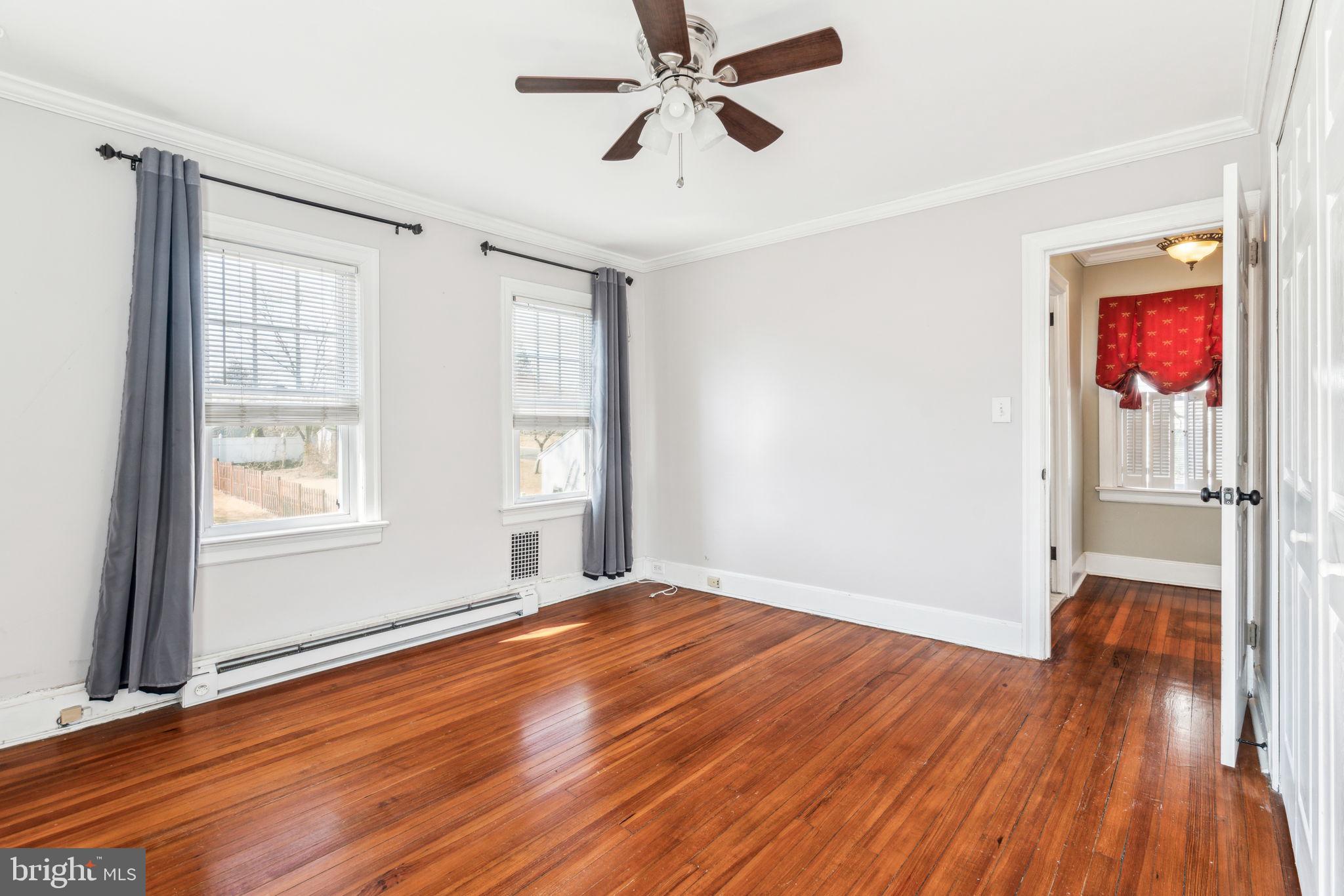 77 Concord Avenue Hamilton, NJ 08619 - Photo 36 of 45 a view of empty room with wooden floor and fan