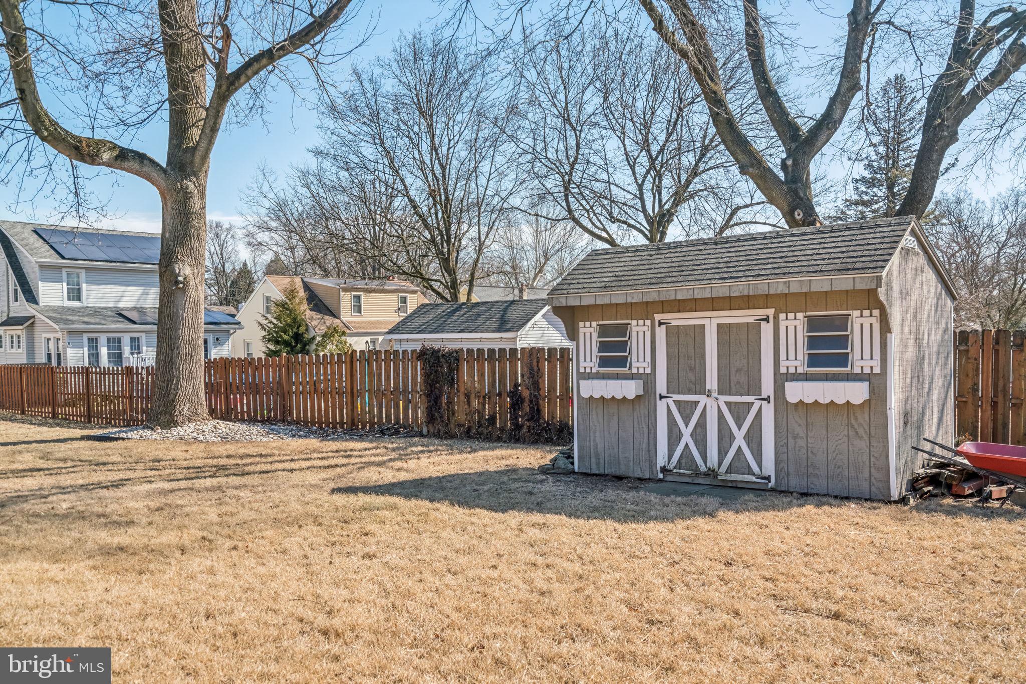 77 Concord Avenue Hamilton, NJ 08619 - Photo 39 of 45 a front view of a house with a yard and garage