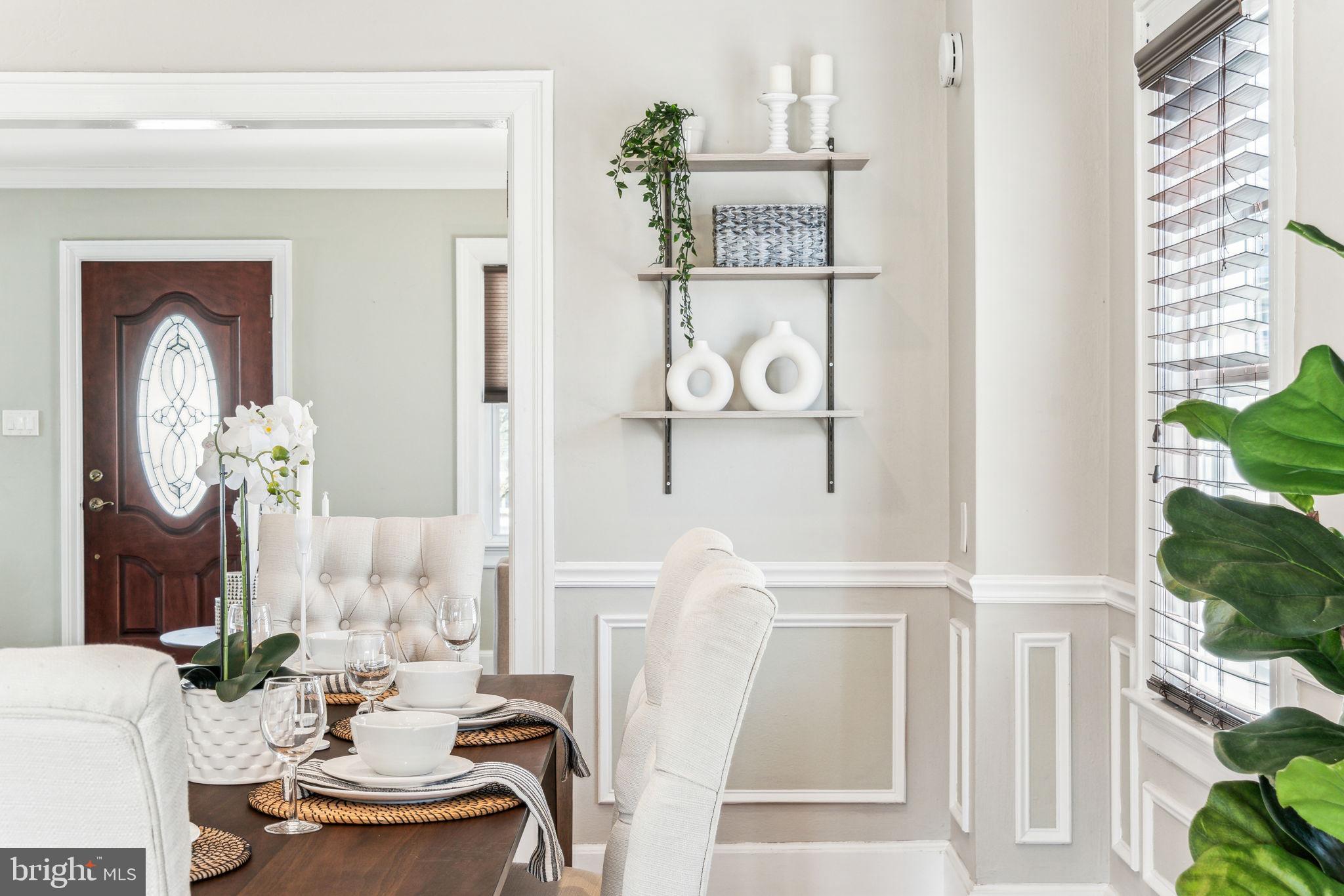 77 Concord Avenue Hamilton, NJ 08619 - Photo 9 of 45 a living room with furniture and a clock