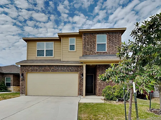 front view of a house with a small yard