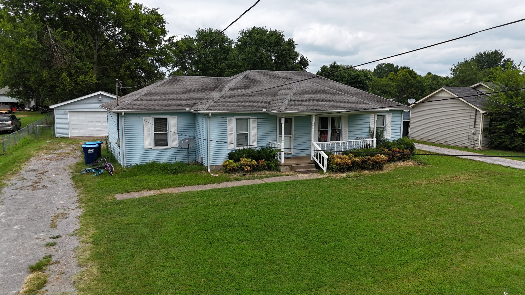 5342 Keystone Court Murfreesboro, TN 37129 - Photo 12 of 21 a backyard of a house with table and chairs plants and large tree