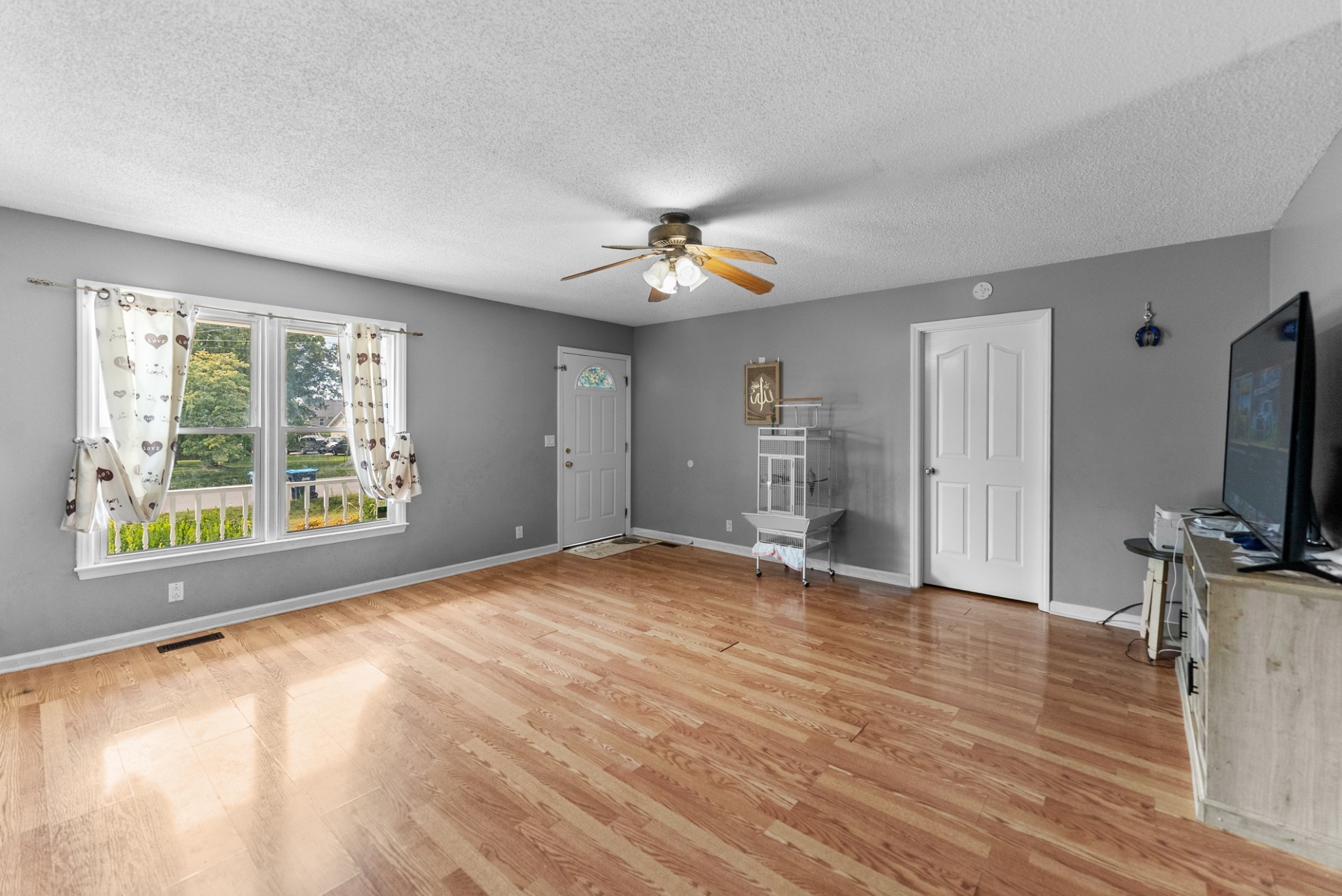 5342 Keystone Court Murfreesboro, TN 37129 - Photo 5 of 21 wooden floor in an empty room with a window