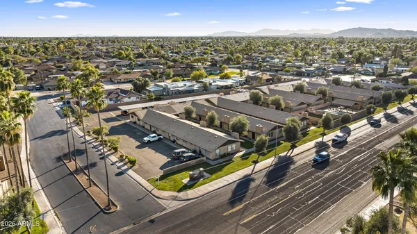 a side view of a house with a yard