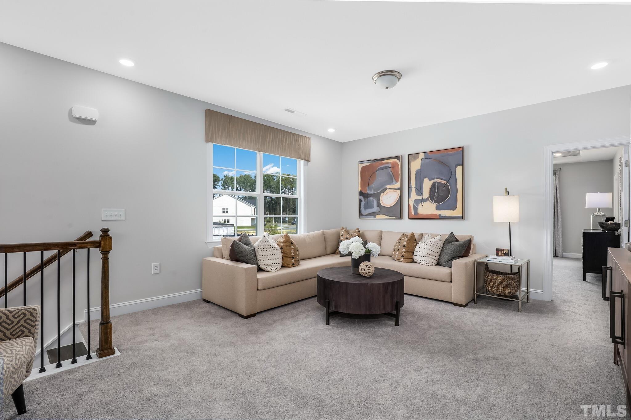 3937 Mount Moran Road Raleigh, NC 27616 - Photo 14 of 18 a living room with furniture and a window