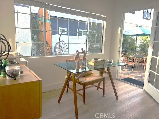 a dining room with furniture and a window