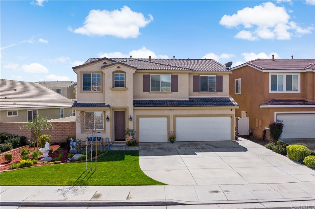 26319 Rim Creek Path Menifee, CA 92584 - Photo 1 of 1 a view of a white house with a yard and plants