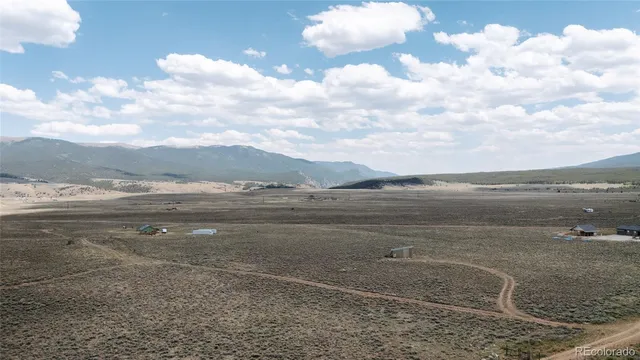 a view of an ocean beach and mountain