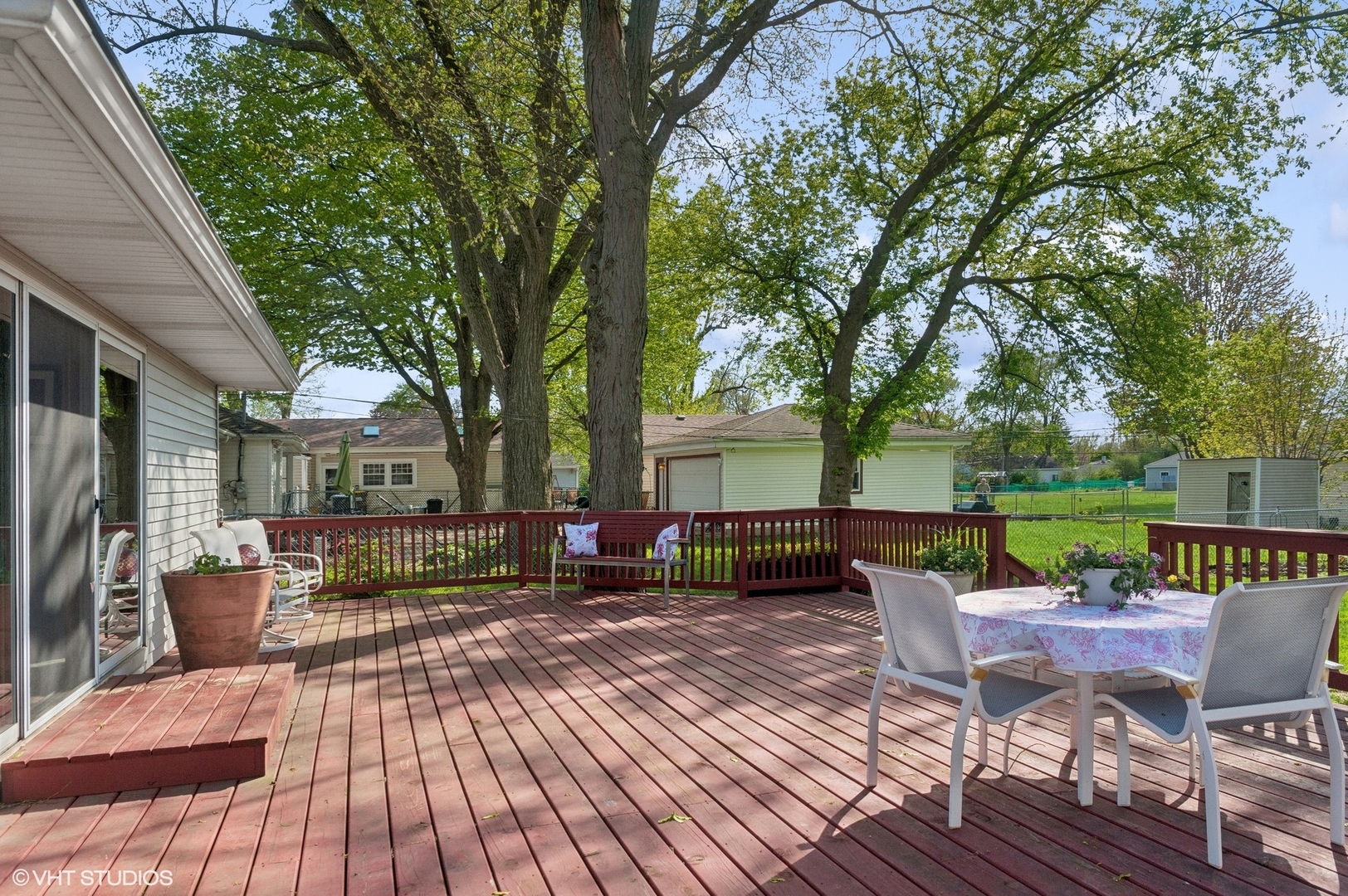 2305 Jay Lane Rolling Meadows, IL 60008 - Photo 14 of 18 a view of a patio with couches potted plants and a large tree