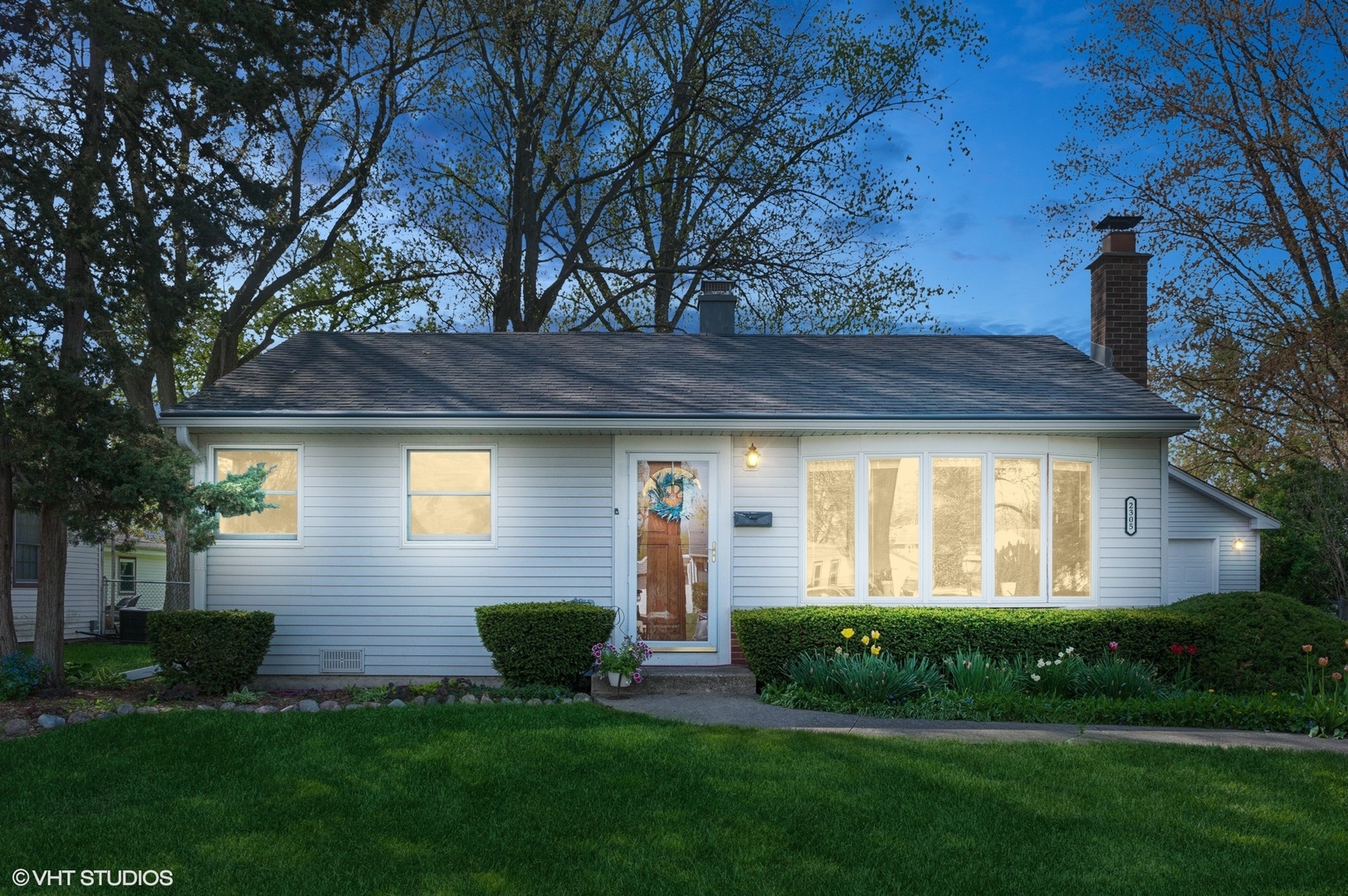2305 Jay Lane Rolling Meadows, IL 60008 - Photo 18 of 18 a view of a brick house with a yard